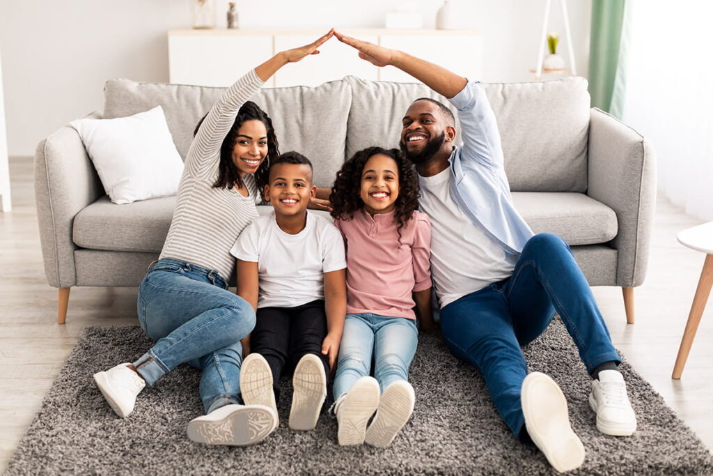 happy family sitting in insured home