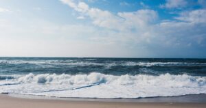 Tide coming in on an Atlantic Ocean beach, symbolizing Sablich Insurance navigating changing tides in the insurance industry