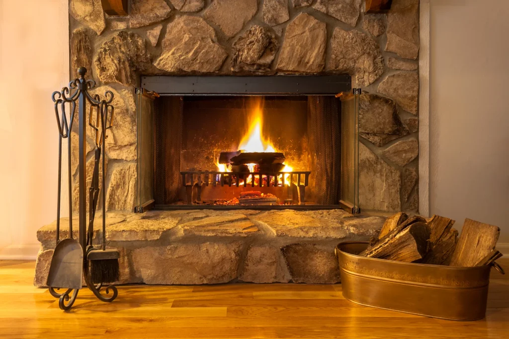 Warm fire burning in a stone fireplace on a cold evening